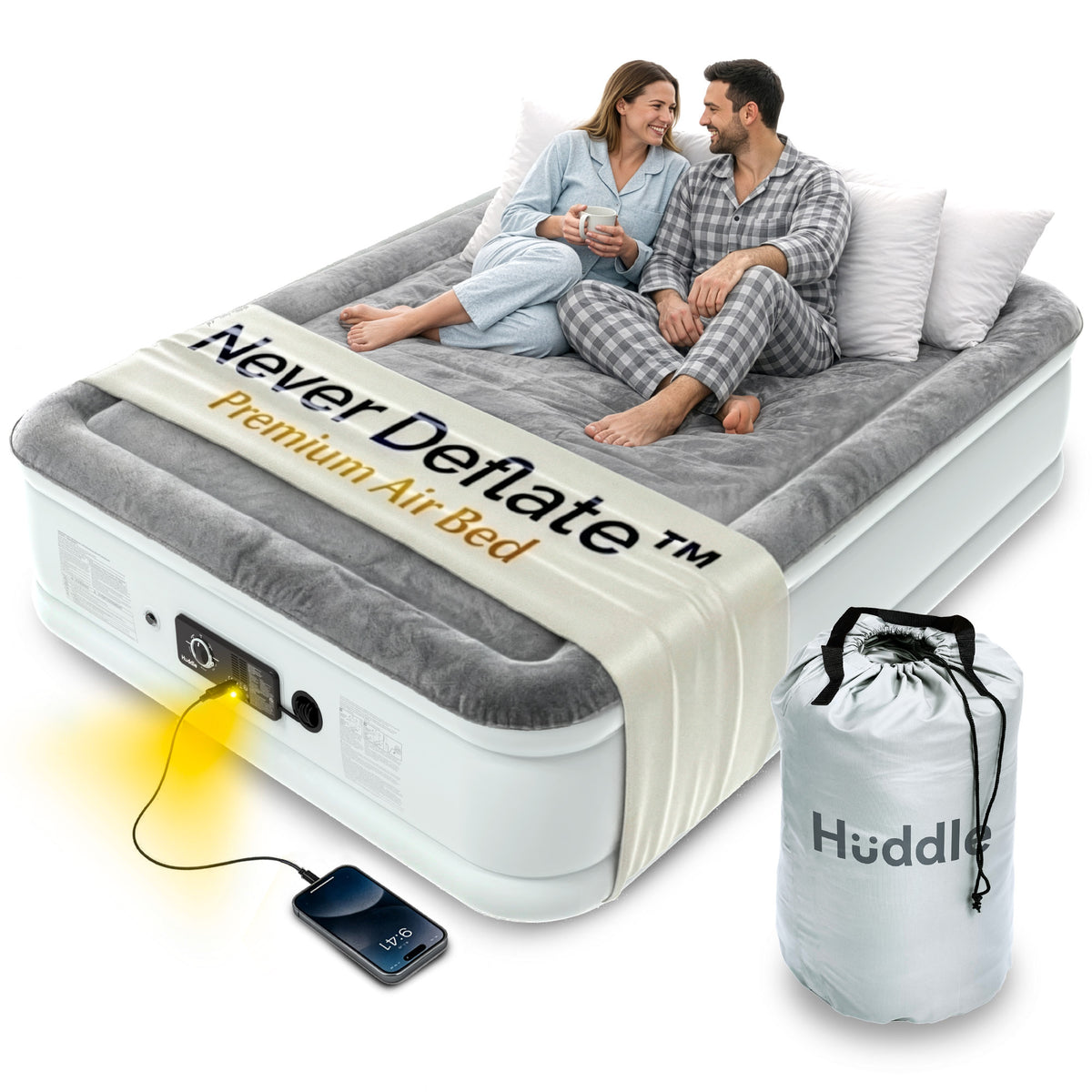 Double air mattress with two people seated, built-in pump connected to a phone, and storage bag beside it